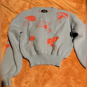 blue/purple ish crew neck top with neon pink mushrooms!